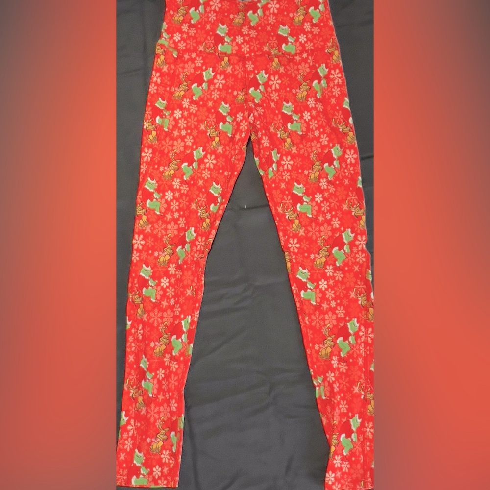 Spread Holiday Cheer while wearing a pair of The Grinch Leggings!! With POCKETS!